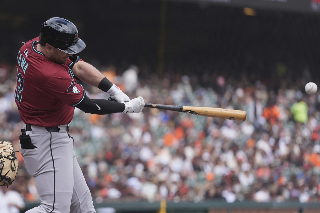 Arizona Diamondbacks' Tim Tawa hits an RBI single against the San Francisco Giants during the second inning of a baseball game in San Francisco, Wednesday, Sept. 10, 2025. (AP Photo/Jeff Chiu)
