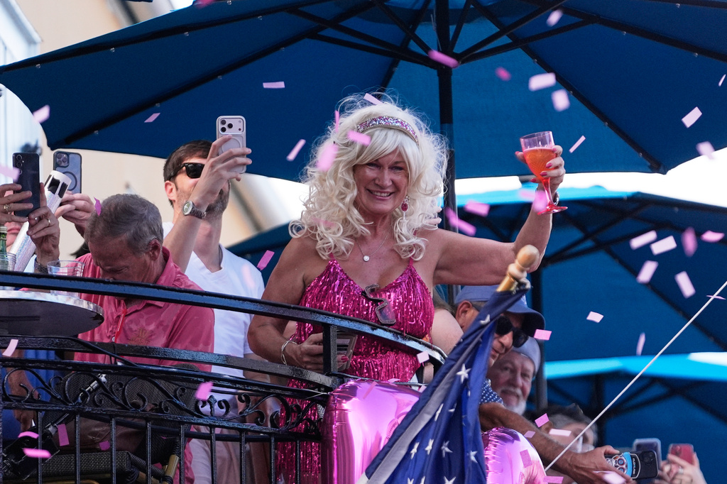 Members of the Krewe of Dolly lead a second line parade in commemoration of the life of Dolly Parton through the French Quarter Friday, Sept. 25, 2026, in New Orleans. (AP Photo/Gerald Herbert)