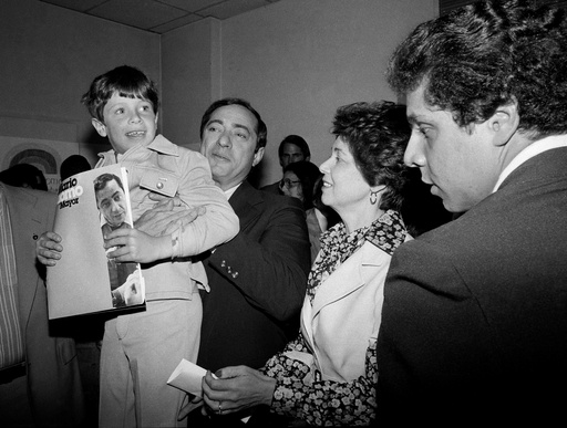 FILE — In this 1977 file photo, New York Secretary of State Mario Cuomo, holds up his son, Christopher, 6, during a press conference as his wife Matilda, center, and son Andrew, 19, right, look on, during his run for mayor of New York City. (AP Photo, File) FILE — In this 1977 file photo, New York Secretary of State Mario Cuomo, holds up his son, Christopher, 6, during a press conference as his wife Matilda, center, and son Andrew, 19, right, look on, during his run for mayor of New York City. (AP Photo, File)