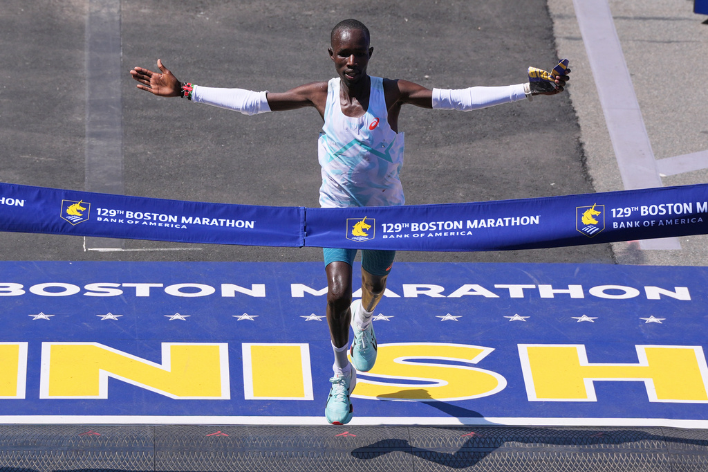 FILE - John Korir, of Kenya, breaks the tape to win the Boston Marathon, Monday, April 21, 2025, in Boston. (AP Photo/Charles Krupa, File)