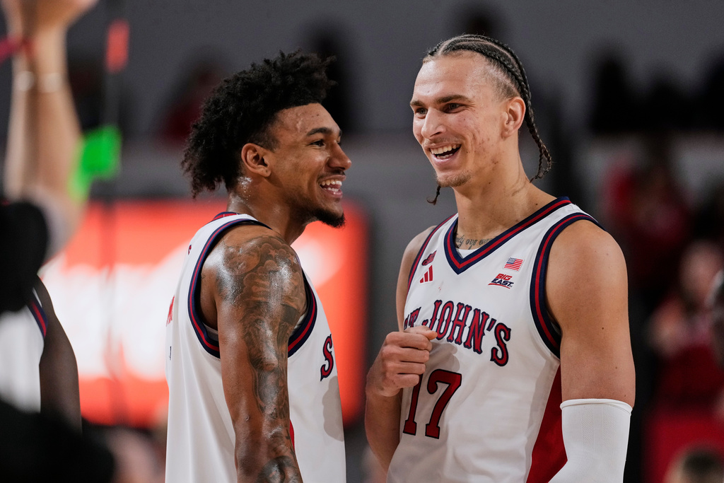 St. John's' Dillon Mitchell, left, celebrates with Rubén Prey, right, during the second half of an NCAA college basketball game against the Bucknell Thursday, Nov. 20, 2025, in New York. (AP Photo/Frank Franklin II)
