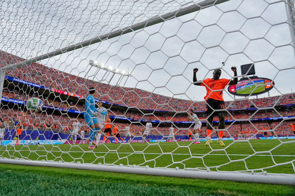 Netherlands' Brian Brobbey (19) celebrates after Tunisia's Ellyes Skhiri (17) scored an own goal during the World Cup Group F soccer match between Tunisia and the Netherlands in Kansas City, Mo., Thursday, June 25, 2026. (AP Photo/Charlie Riedel)