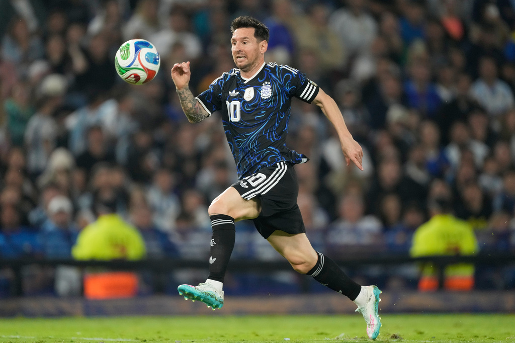 FILE - Argentina's Lionel Messi runs with the ball during a friendly soccer match against Mauritania in Buenos Aires, Argentina, Friday, March 27, 2026. (AP Photo/Gustavo Garello, File)
