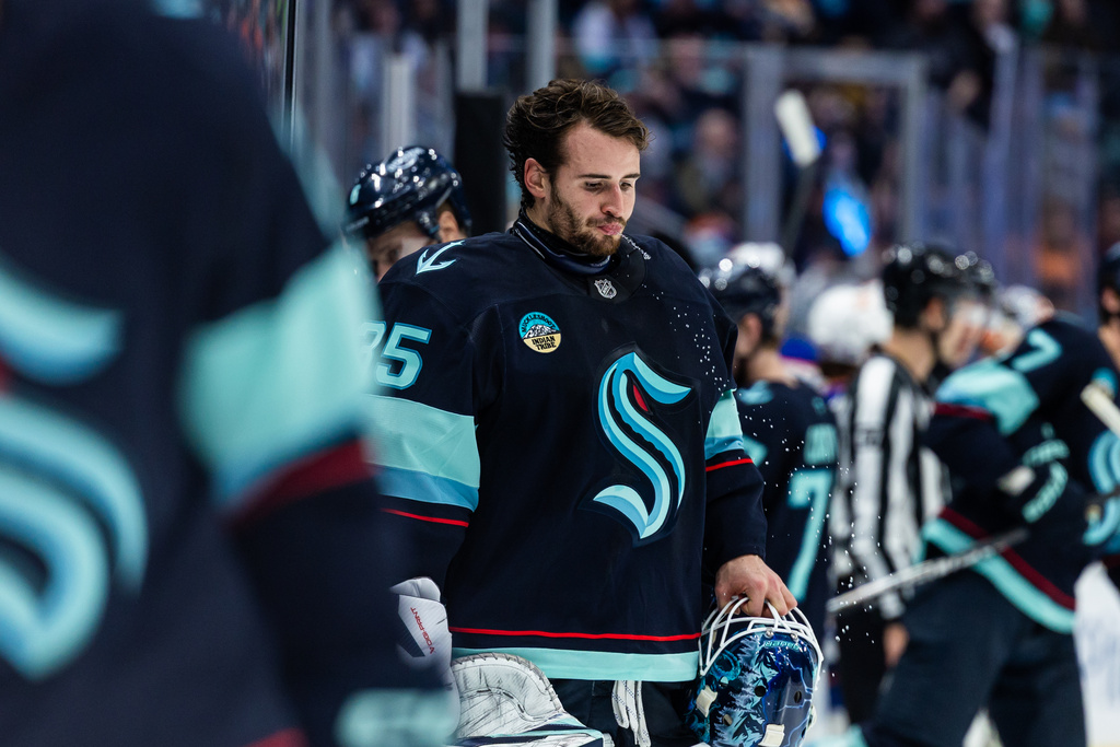 Seattle Kraken goaltender Joey Daccord spits out water during the third period of an NHL hockey game against the Edmonton Oilers, Saturday, Nov. 29, 2025, in Seattle. (AP Photo/Maddy Grassy)