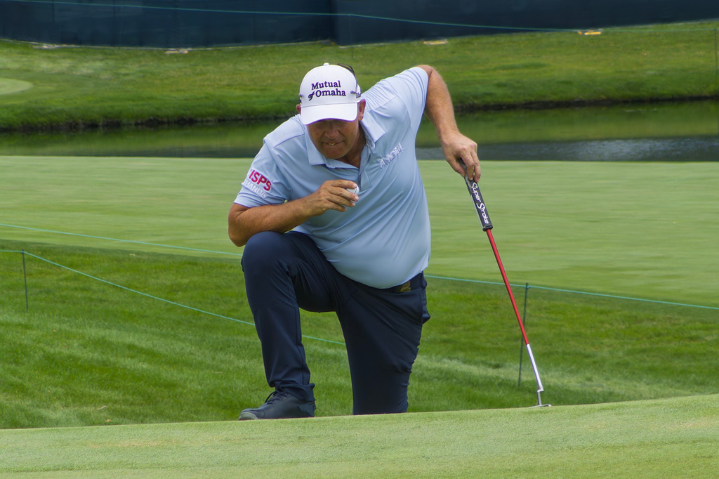 Padraig Harrington eyes his putt for par on the 18th hole during the final round of the U.S. Senior Open at Scioto Country Club in Columbus, Ohio, on July 5, 2026. (AP Photo/Joe Reedy)