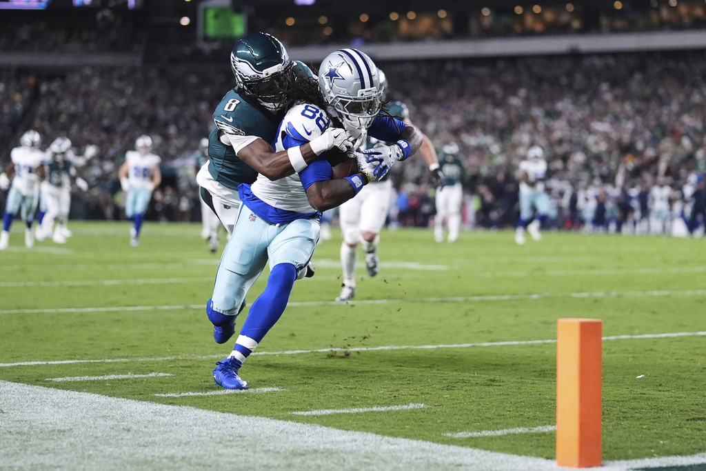 Dallas Cowboys wide receiver CeeDee Lamb (88) catches a pass and is stopped short of the end zone by Philadelphia Eagles cornerback Adoree' Jackson (8) in the first half of an NFL football game Thursday, Sept. 4, 2025, in Philadelphia. (AP Photo/Matt Slocum)