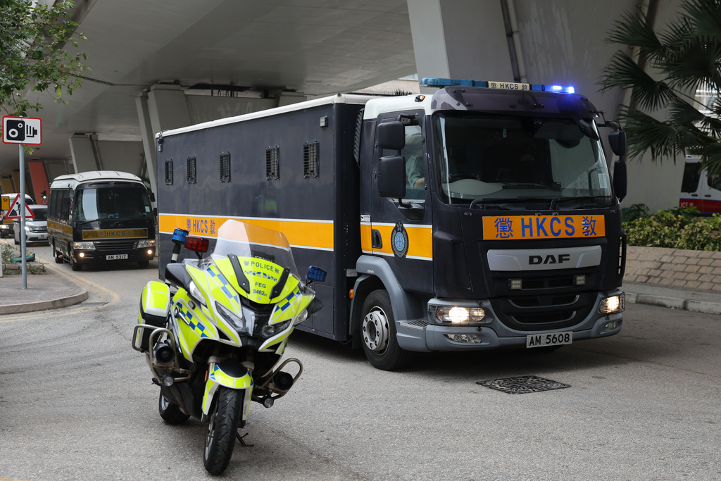 Correctional Services Department vehicles arrive at the West Kowloon Magistrates' Courts, ahead of a hearing to hear arguments about the sentencing of democracy advocate and onetime media magnate Jimmy Lai, in Hong Kong, Monday, Jan. 12, 2026. (AP Photo/May James)