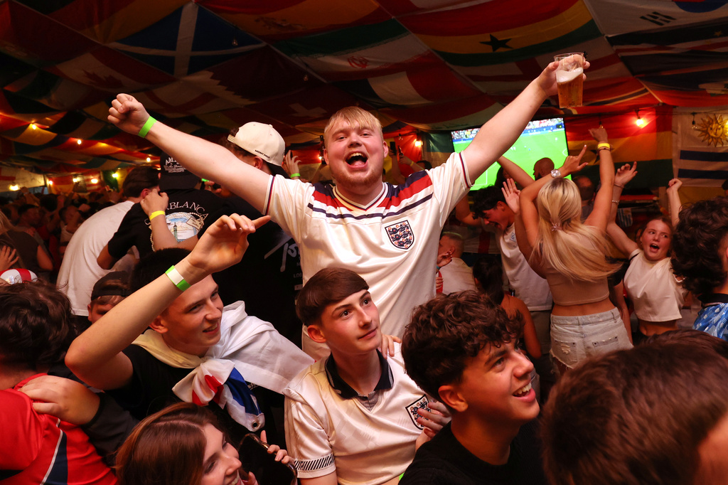 England supporters celebrate during the World Cup soccer match between England and Croatia at The Clock pub in Hebburn, England, Wednesday, June 17, 2026. (AP Photo/Scott Heppell)