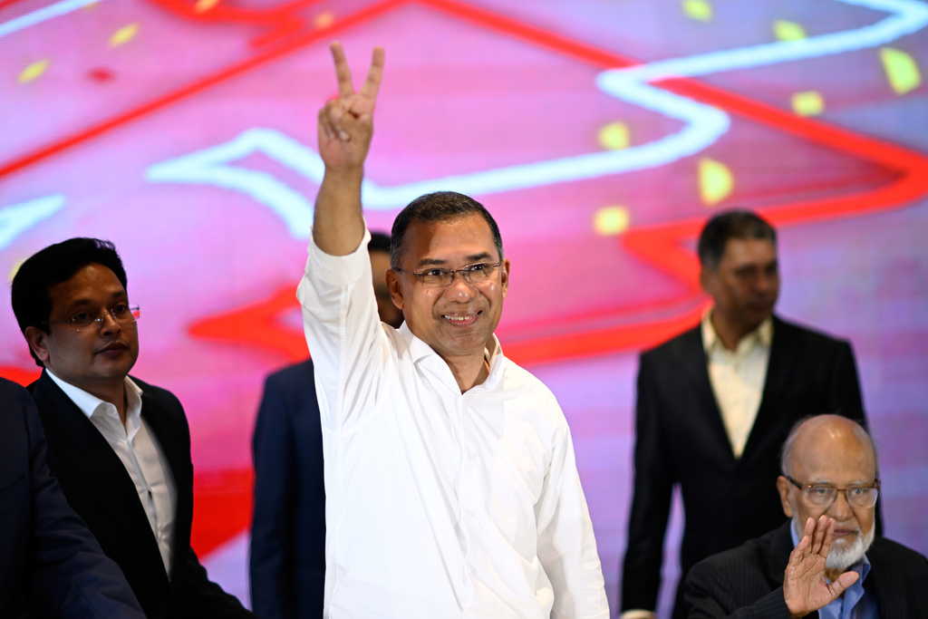 Bangladesh Nationalist Party Chairperson Tarique Rahman greets supporters after his party won the national parliamentary election, in Dhaka, Bangladesh, Saturday, Feb. 14, 2026. (AP Photo/Mahmud Hossain Opu)