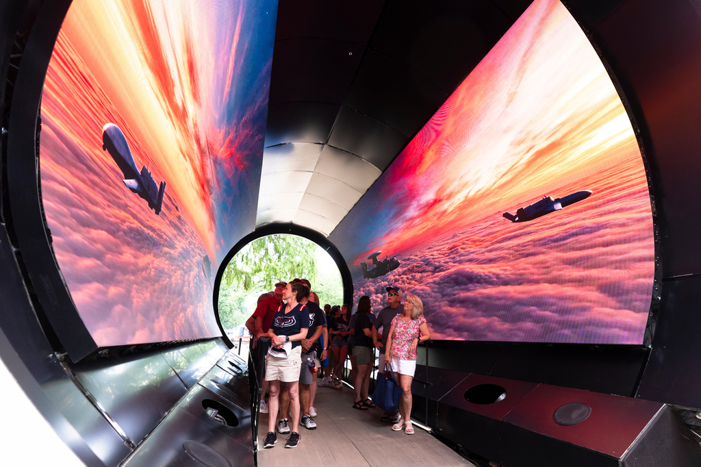 Visitors at the Great American State Fair on the National Mall, experience Northrop Grumman's Sky Tunnel, Wednesday, July 8, 2026, in Washington. (AP Photo/Manuel Balce Ceneta)