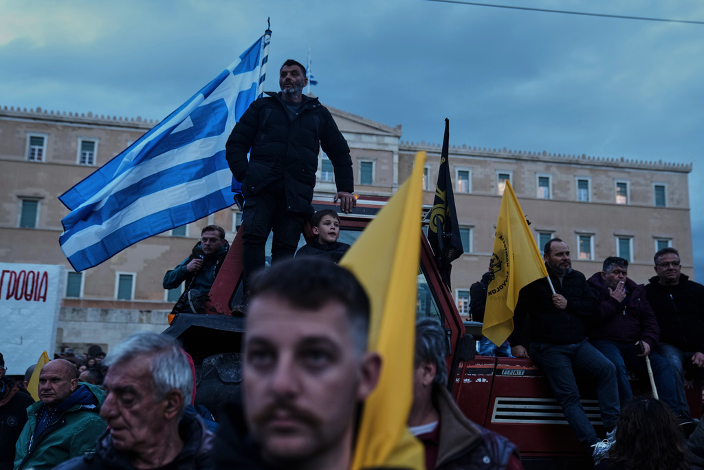 Farmers park their tractors in front of the Greek parliament as they protesting against high production costs, low prices for their products and delays in subsidy payments, in central Athens, on Friday, Feb. 13, 2026. (AP Photo/Petros Giannakouris)
