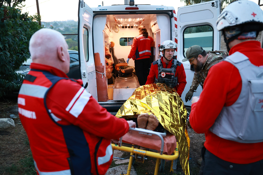 Medics inspect a body of a woman killed in a Russian strike on residential neighbourhood on Zaporizhzhia, Ukraine, on Saturday, Sept. 26, 2026. (AP Photo/Kateryna Klochko)