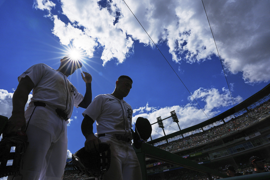 Detroit Tigers left fielder Riley Greene, left, and right fielder Jahmai Jones walk back to the dugout during the fifth inning of a baseball game against the Kansas City Royals, Sunday, Aug. 24, 2025, in Detroit. (AP Photo/Ryan Sun)