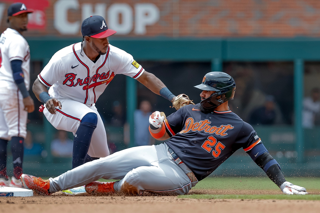 Detroit Tigers' Gleyber Torres (25) is tagged out by Atlanta Braves shortstop Jorge Mateo (2) while trying to stretch a single into a double during the fifth inning of a baseball game, Thursday, April 30, 2026, in Atlanta. (AP Photo/Erik S. Lesser)