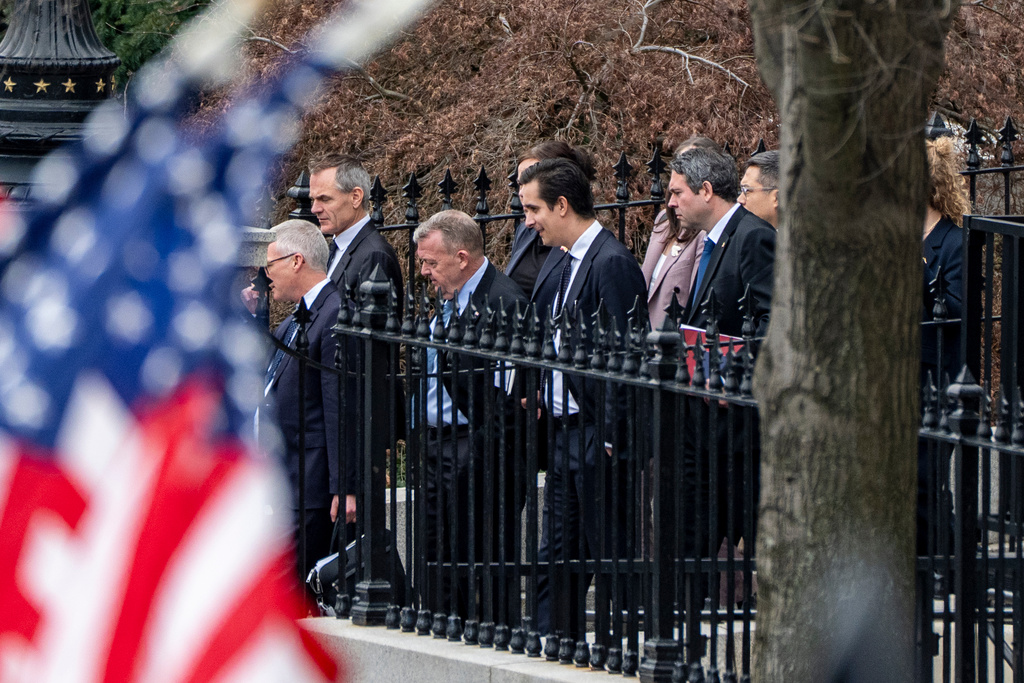 Denmark's Foreign Minister Lars Løkke Rasmussen, third from left, Greenland's Foreign Minister Vivian Motzfeldt, not shown, and their delegations leave the Old Eisenhower Executive Office Building on the grounds of the White House, Wednesday, Jan. 14, 2026, in Washington. (AP Photo/Alex Brandon)