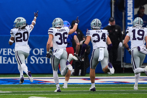 Kansas State linebacker Ralph Ortiz (20) is chased into the end zone to score a touchdown after recovering a fumble during the first half of an NCAA college football game against Kansas, Saturday, Oct. 25, 2025, in Lawrence, Kan. (AP Photo/Charlie Riedel) Kansas State linebacker Ralph Ortiz (20) is chased into the end zone to score a touchdown after recovering a fumble during the first half of an NCAA college football game against Kansas, Saturday, Oct. 25, 2025, in Lawrence, Kan. (AP Photo/Charlie Riedel)
