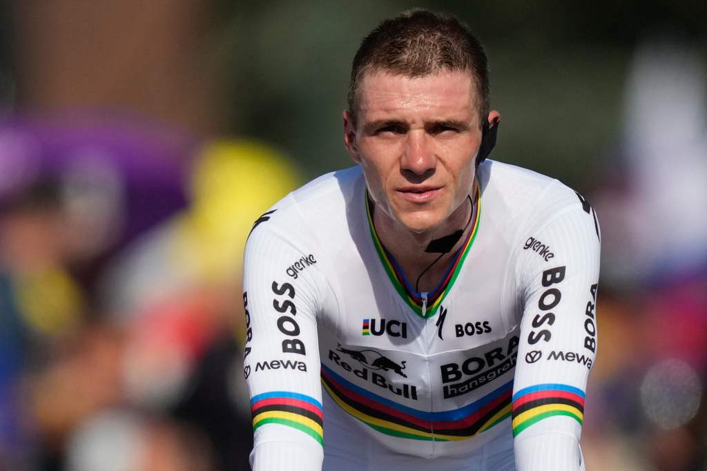 Belgium's Remco Evenepoel rides to the podium after the sixteenth stage of the Tour de France cycling race, an indivdual time-trial with start in Evian-Les-Bains and finish in Thonon-les-Bains, France, Tuesday, July 21, 2026. (AP Photo/Mosa'ab Elshamy)