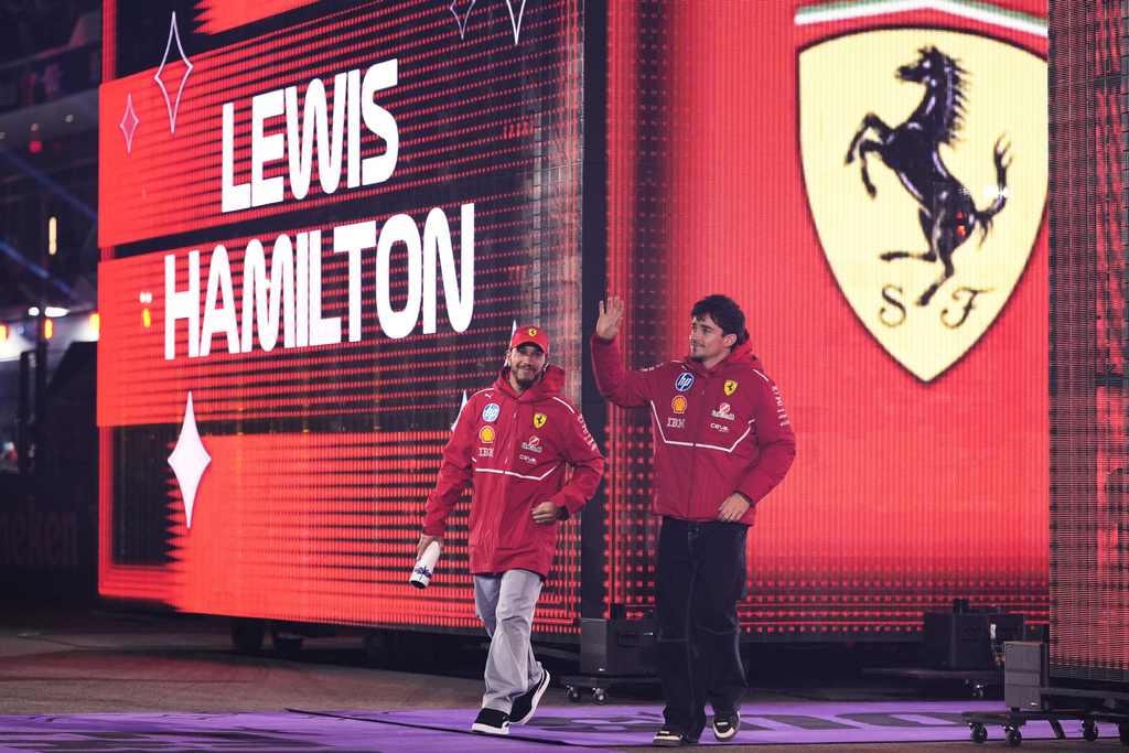 Ferrari driver Lewis Hamilton of Great Britain and Ferrari driver Charles Leclerc of Monaco are introduced before the Formula One Las Vegas Grand Prix auto race, Saturday, Nov. 22, 2025 in Las Vegas. (AP Photo/Eric Gay)