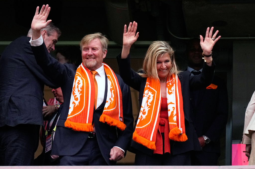 King Willem-Alexander and Queen Maxima of the Netherlands wave from the tribune before the World Cup Group F soccer match between the Netherlands and Sweden in Houston, Saturday, June 20, 2026. (AP Photo/Ashley Landis)