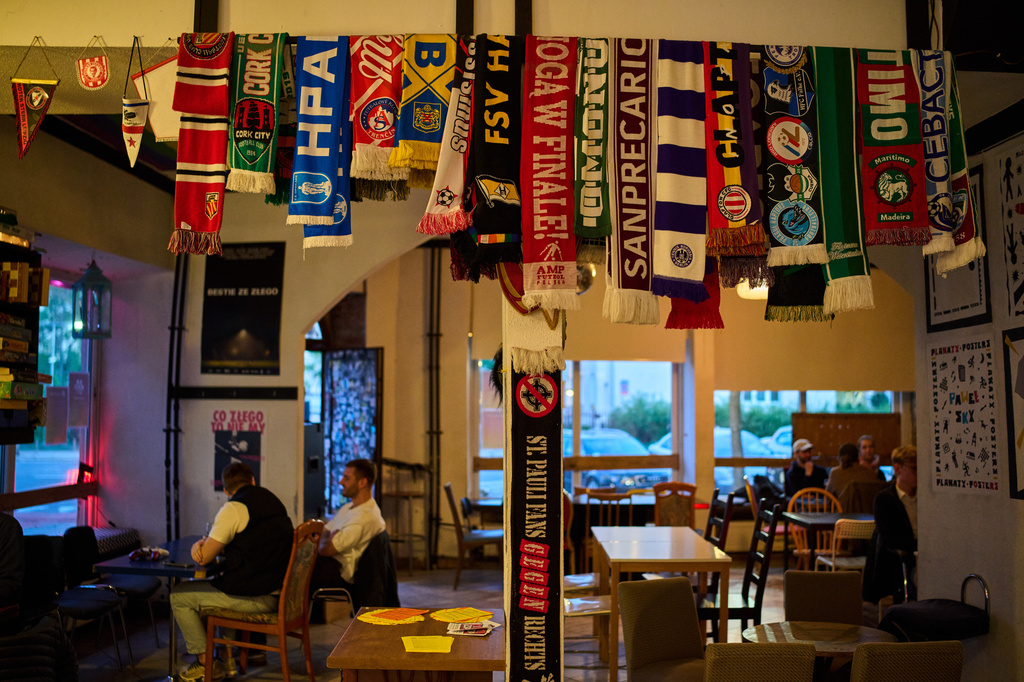 Anti-fascist team scarves are collected at the Offside bar, while AKS Zly Praga soccer team fans gather at the Offside bar, in Praga district in Warsaw, Poland, Friday, April 24, 2026. (AP Photo/Ebrahim Noroozi)