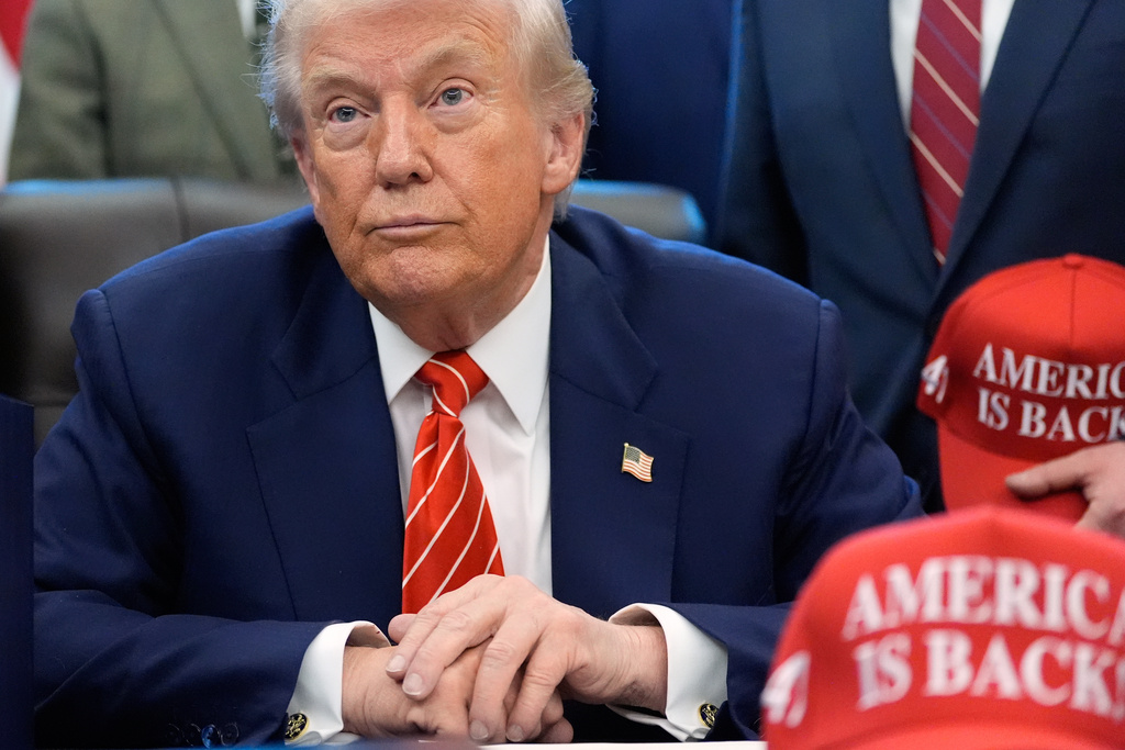 President Donald Trump speaks to reporters after signing a spending bill that ends a partial shutdown of the federal government in the Oval Office of the White House, Tuesday, Feb. 3, 2026, in Washington. (AP Photo/Alex Brandon)