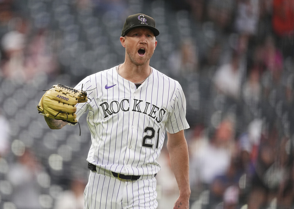 Colorado Rockies starting pitcher Kyle Freeland yells at San Francisco Giants' Rafael Devers after his two-run home run in the first inning of a baseball game Tuesday, Sept. 2, 2025, in Denver. (AP Photo/David Zalubowski)