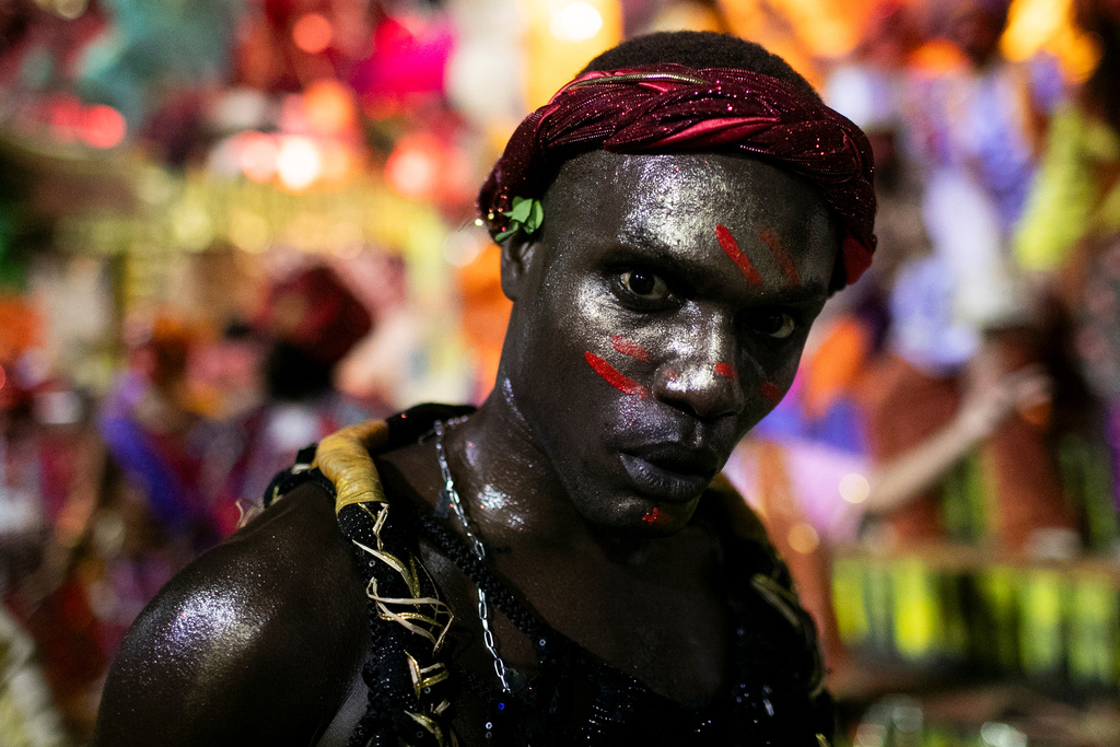 A performer from the Portela samba school parades during Carnival celebrations at the Sambadrome in Rio de Janeiro, early Monday, Feb. 16, 2026. (AP Photo/Bruna Prado)