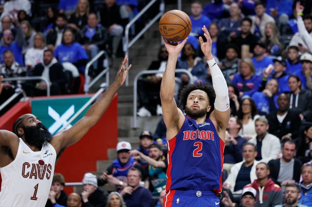 Detroit Pistons guard Cade Cunningham (2) takes a jump shot against Cleveland Cavaliers guard James Harden (1) during the first half in Game 5 of a second-round NBA playoffs basketball series, Wednesday, May 13, 2026, in Detroit. (AP Photo/Duane Burleson)