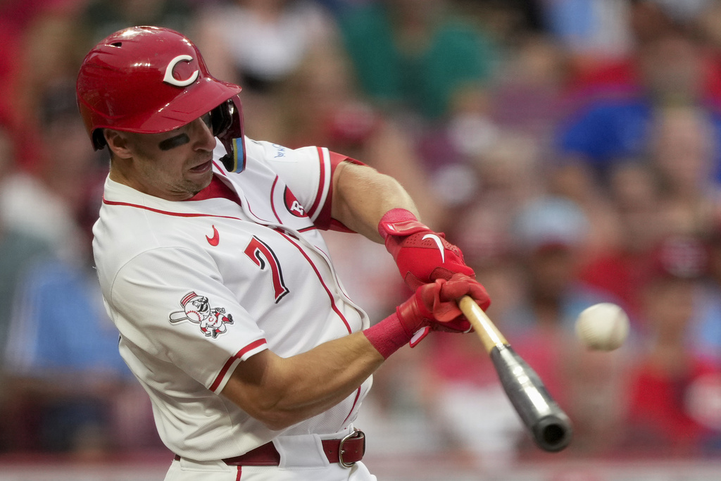 Cincinnati Reds' Spencer Steer hits a two-run double during the third inning of a baseball game against the Philadelphia Phillies Tuesday, Aug. 12, 2025, in Cincinnati. (AP Photo/Carolyn Kaster)