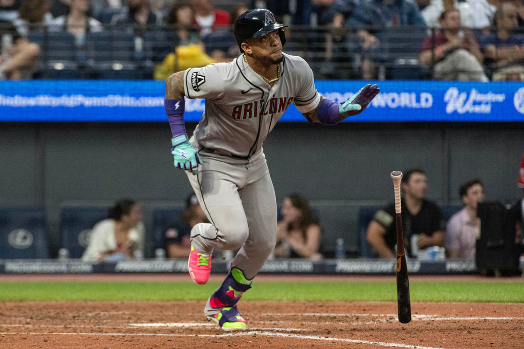 Arizona Diamondbacks' Ketel Marte watches his double off Cleveland Guardians starting pitcher Parker Messick during the fourth inning of a baseball game, Saturday, Aug. 1, 2026, in Cleveland. (AP Photo/Phil Long)