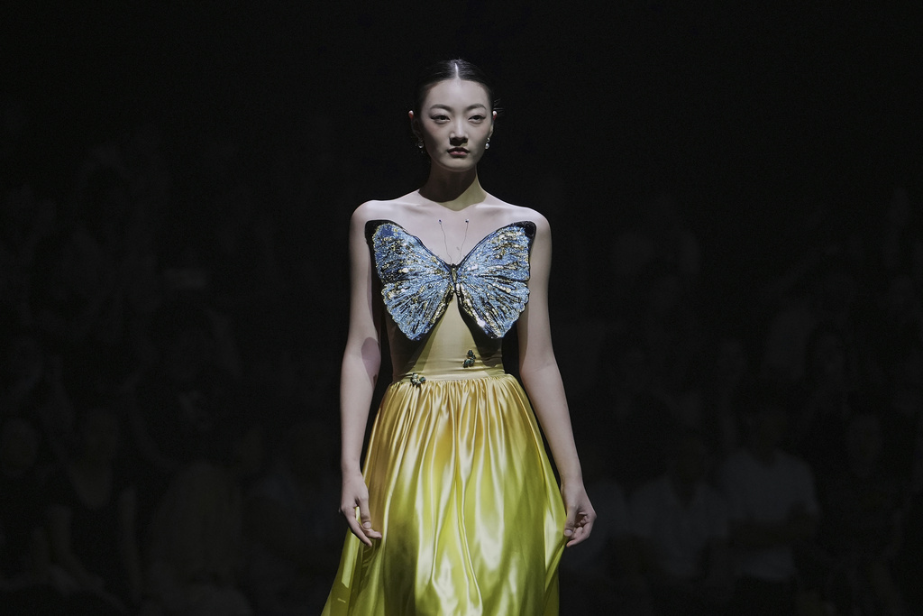 A model showcases a creation from the Lijin collection by Rong He during the SS2026 China Fashion Week, in Beijing, China, Thursday, Sept. 11, 2025. (AP Photo/Andy Wong)