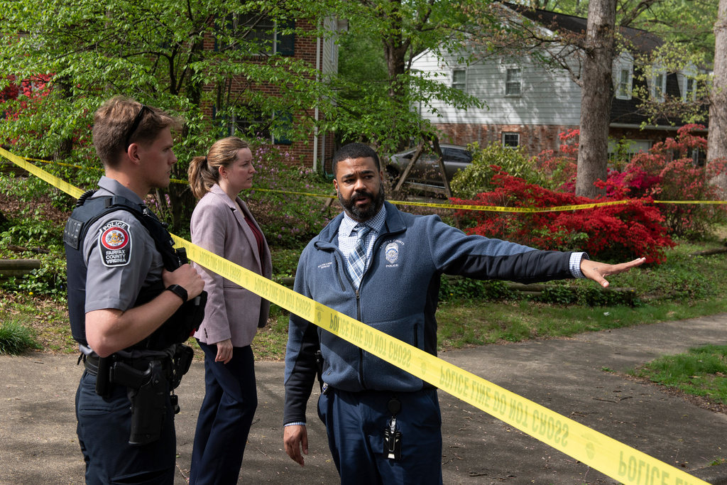 Fairfax County police confer in front of the home of former Virginia Lt. Gov. Justin Fairfax, in Annandale, Va., Thursday, April 16, 2026. (AP Photo/Cliff Owen)