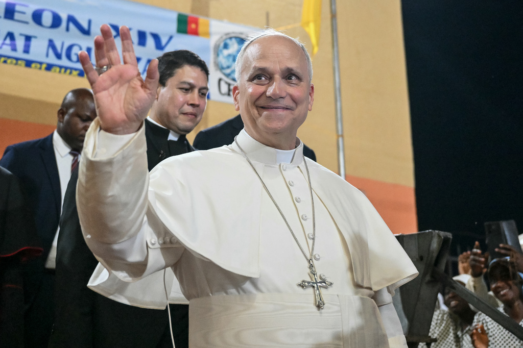 Pope Leo XIV waves to supporters as he leaves after his visit to the Ngul Zamba (Power of God) orphanage in Yaounde, Cameroon, Wednesday April 15, 2026 on the third day of his apostolic journey to Africa. (Alberto Pizzoli, Pool Photo via AP)