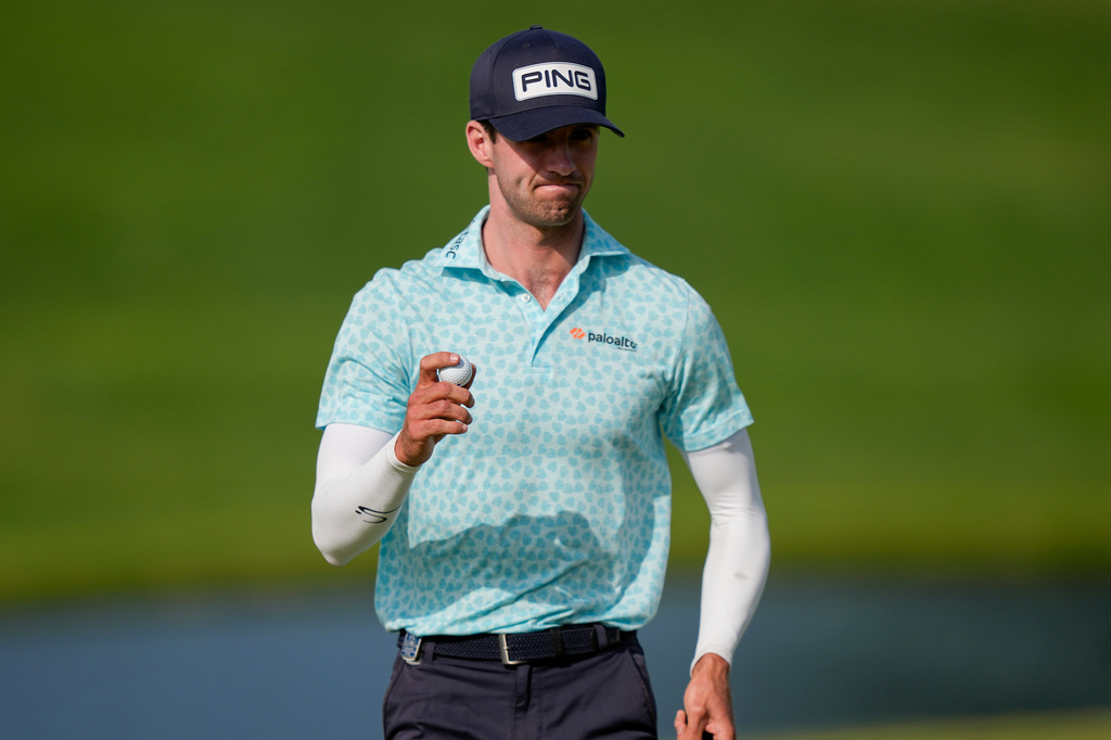 Alex Smalley waves on the 10th green during the third round of the PGA Championship golf tournament at Aronimink Golf Club, Saturday, May 16, 2026, in Newtown Square, PA. (AP Photo/Matt Slocum)