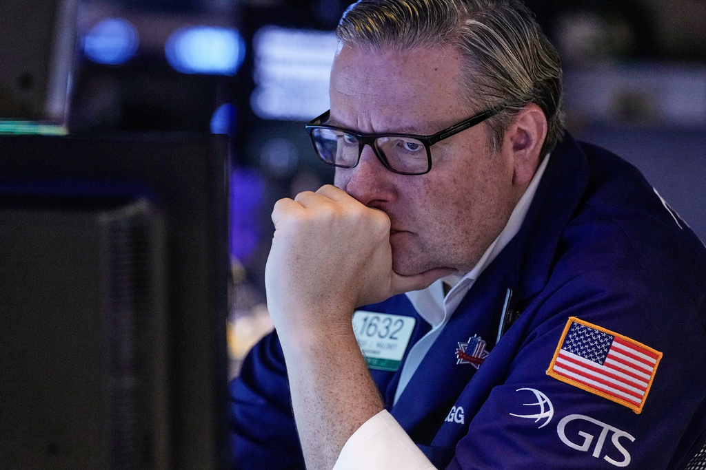 Specialist Gregg Maloney works on the floor of the New York Stock Exchange, Wednesday, Nov. 12, 2025. (AP Photo/Richard Drew)
