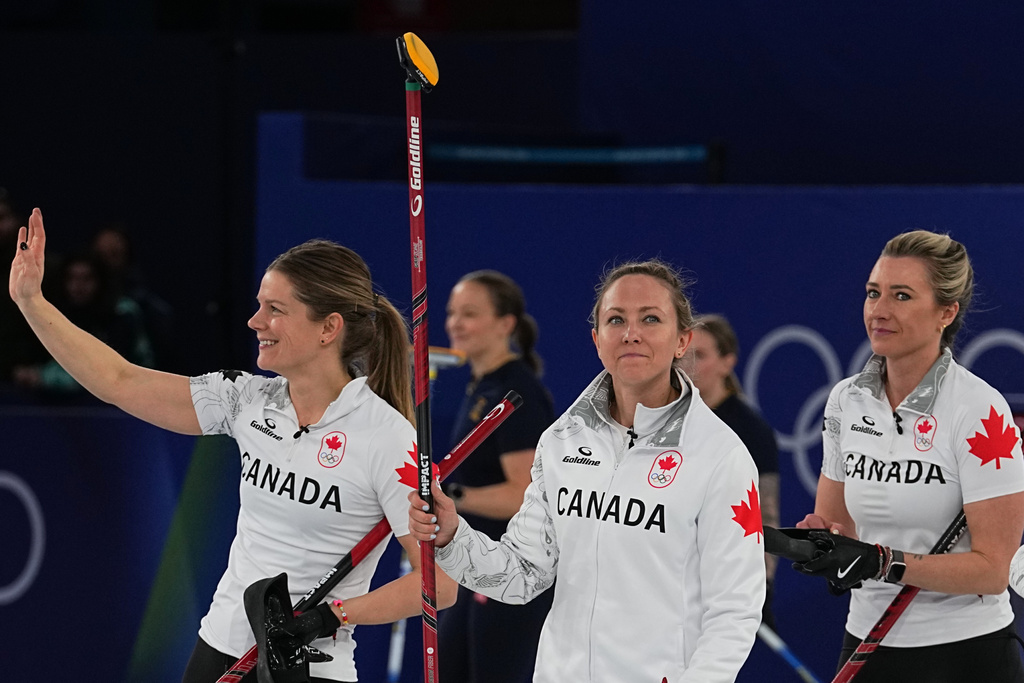 Canada's Rachel Homan, Sarah Wilkes and Emma Miskew react after the women's curling round robin session against China at the 2026 Winter Olympics, in Cortina d'Ampezzo, Italy, Monday, Feb. 16, 2026. (AP Photo/Fatima Shbair)