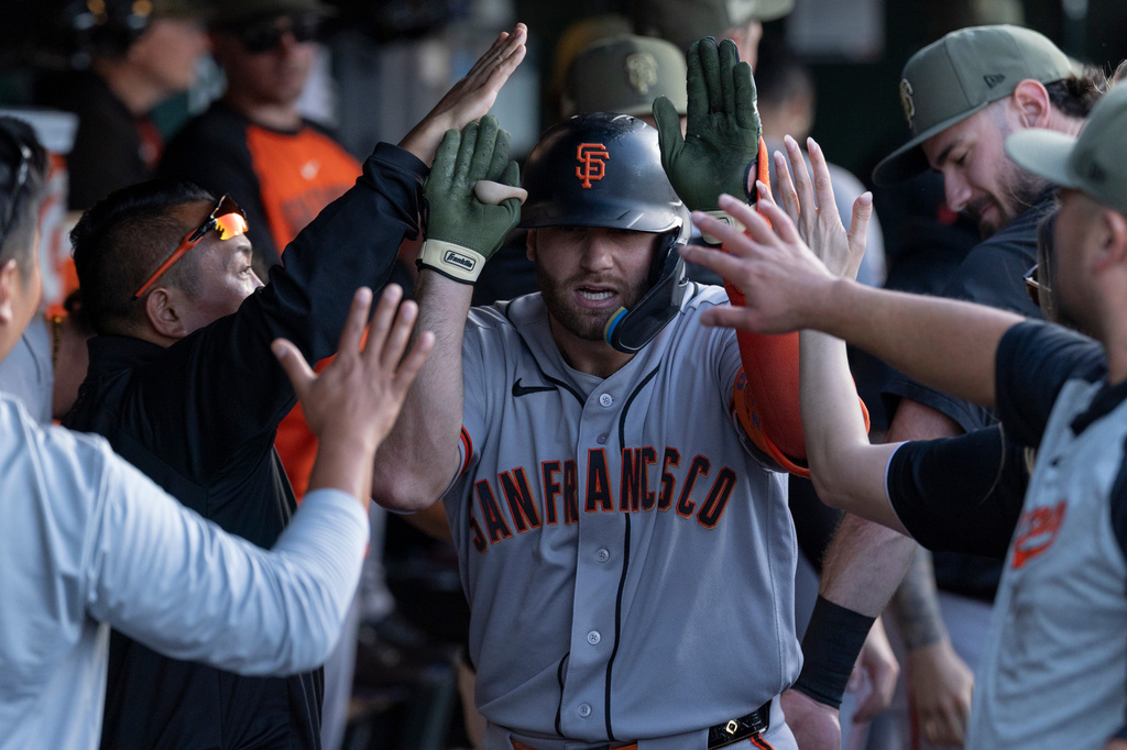 San Francisco Giants' Casey Schmitt celebrates after hitting a home run during the first inning of a baseball game against Athletics, Saturday, May 16, 2026, in West Sacramento, Calif. (AP Photo/Sara Nevis)