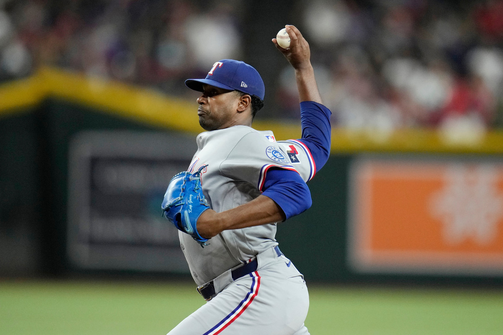 Texas Rangers starting pitcher Kumar Rocker throws against the Arizona Diamondbacks during the third inning of a baseball game, Saturday, Sept. 12, 2026, in Phoenix. (AP Photo/Ross D. Franklin)