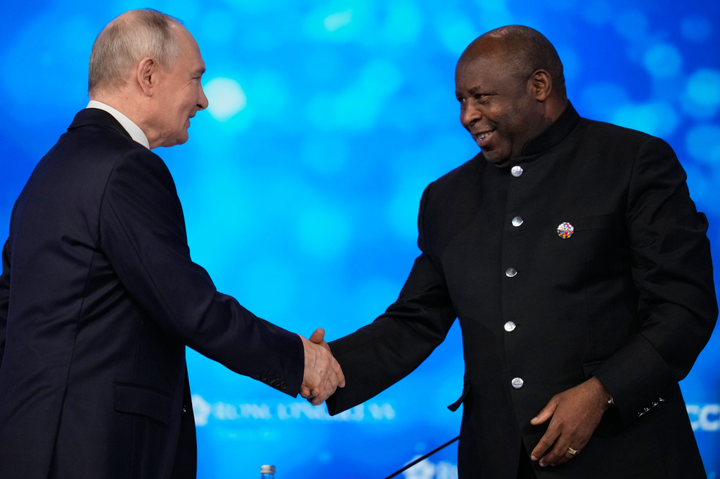 Russian President Vladimir Putin, left, and Burundi's President Evariste Ndayishimiye shake hands during the plenary session of the Russia-Africa Summit in Moscow, Wednesday, Oct. 28, 2026. (AP Photo/Pavel Bednyakov)