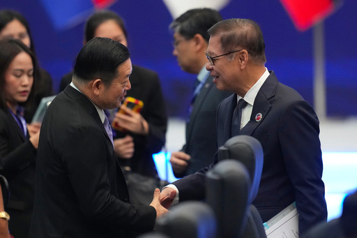 Thailand's Foreign Minister Sihasak Phuangketkeow, right, shakes hands with ASEAN Secretary-General Kao Kim Hourn as they arrive to attend the ASEAN foreign ministers' meeting in Kuala Lumpur, Malaysia, Saturday, Oct. 25, 2025. (AP Photo/Rafiq Maqbool) Thailand's Foreign Minister Sihasak Phuangketkeow, right, shakes hands with ASEAN Secretary-General Kao Kim Hourn as they arrive to attend the ASEAN foreign ministers' meeting in Kuala Lumpur, Malaysia, Saturday, Oct. 25, 2025. (AP Photo/Rafiq Maqbool)