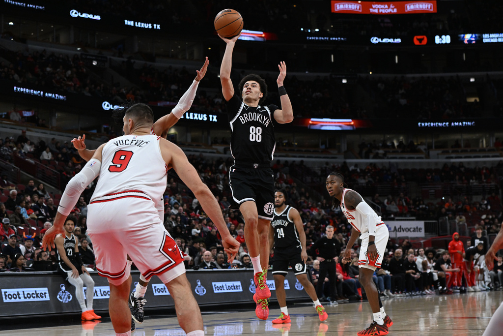 Brooklyn Nets' Nolan Traore (88) goes up for a shot during the first half of an NBA basketball game against the Chicago Bulls, Sunday, Jan. 18, 2026, in Chicago. (AP Photo/Paul Beaty)