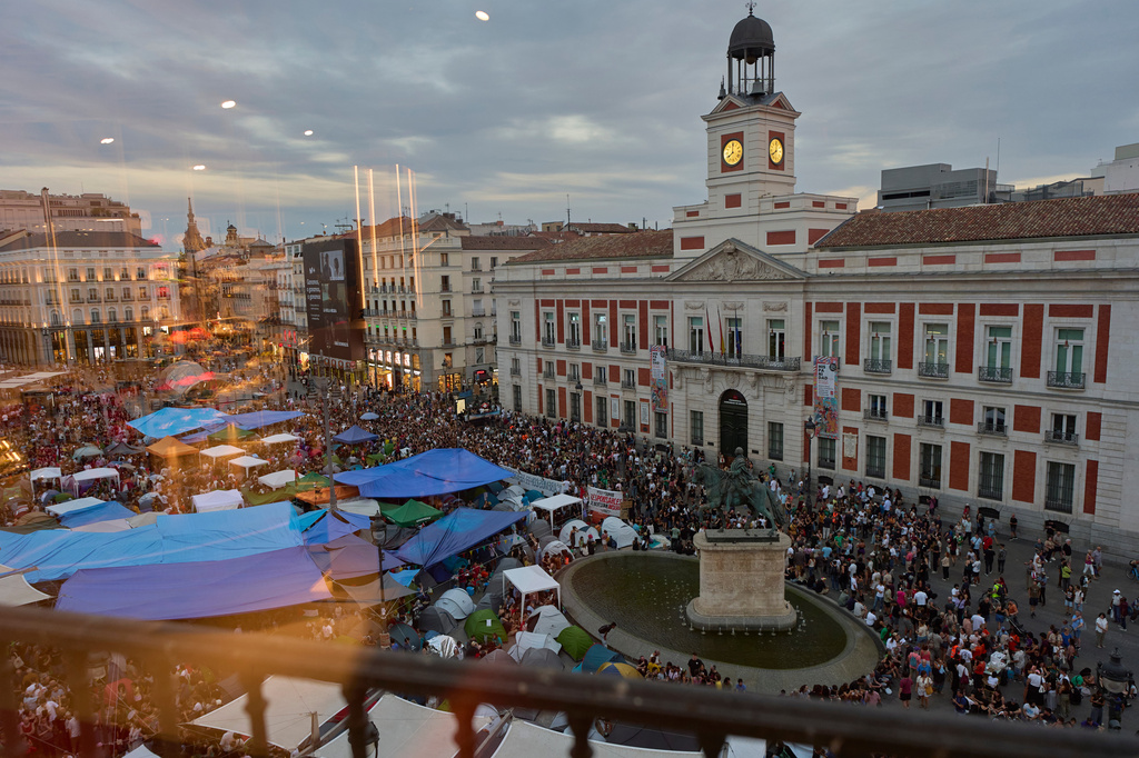 Protesters camp during a protest following the eviction last Wednesday of 87-year-old Maricarmen to demand stronger laws to protect renters at Sol square in Madrid, Spain, Sunday, Sept. 27, 2026. (AP Photo/Manu Fernandez)