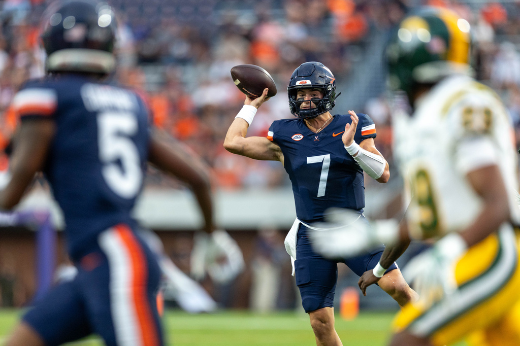 Virginia quarterback Beau Pribula (7) looks to make a pass during an NCAA college football game against Norfolk State on Friday, Sept. 11, 2026, in Charlottesville, VA. (AP Photo/Mike Kropf)