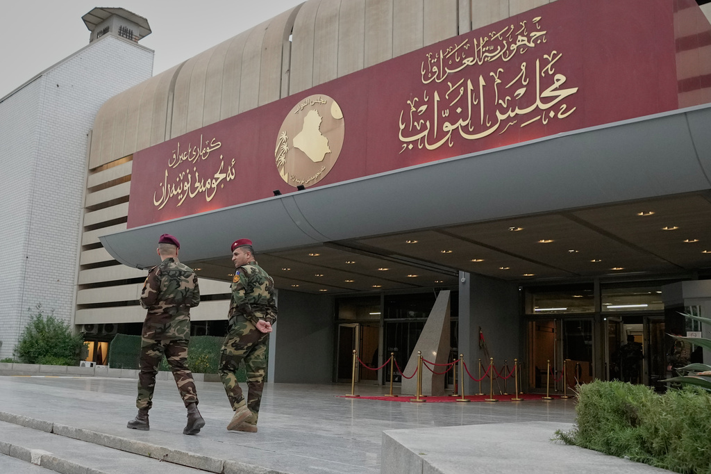 Guards prepare for the arrival of Parliament members at the parliament building hall to elect the President of the Republic, in Baghdad, Iraq, Saturday, April11, 2026. (AP Photo/Hadi Mizban)