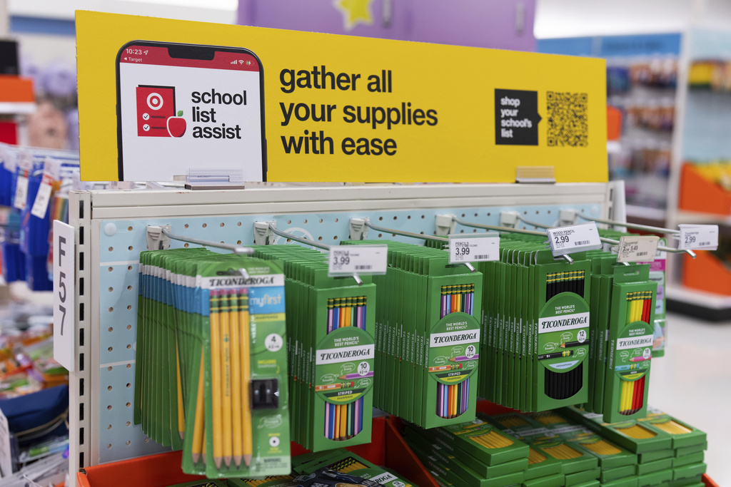 Information on a school list assist and a QR code is displayed above pencils for sale in the back-to-school supplies section of a Target in Sherwood, Ore., Friday, Aug. 8, 2025. (AP Photo/Jenny Kane)