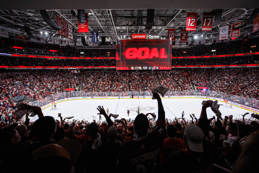 Carolina Hurricanes fans react after a goal against the Vegas Golden Knights during the second period of Game 5 of the NHL hockey Stanley Cup Final series in Raleigh, N.C., Thursday, June 11, 2026. (AP Photo/Ben McKeown)