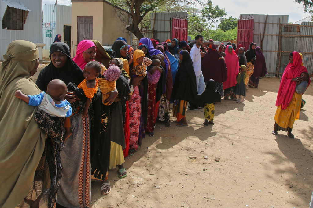 FILE - Somali women displaced by drought line up at Feynuus Nutrition Centre on the outskirts of the capital, Mogadishu, Somalia, Aug. 19, 2026. (AP Photo/Farah Abdi Warsameh, File)