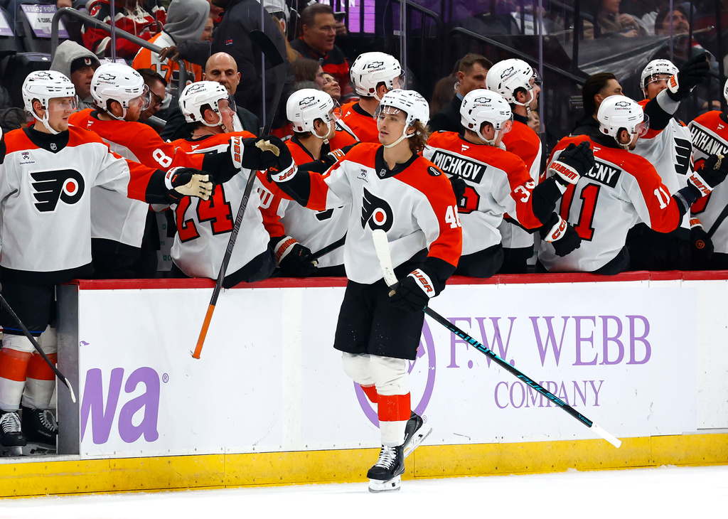 Philadelphia Flyers center Trevor Zegras (46) celebrates with teammates after scoring a goal against the New Jersey Devils during the second period of an NHL hockey game, Saturday, Nov. 29, 2025, in Newark, N.J. (AP Photo/Noah K. Murray)