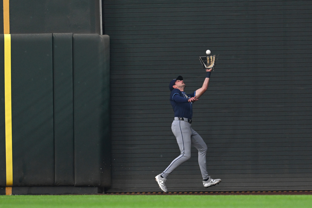 Tampa Bay Rays right fielder Josh Lowe catches a ball in foul territory hit by Baltimore Orioles Jordan Westburg in the first inning of a baseball game, Wednesday, Sept. 24, 2025, in Baltimore. (AP Photo/Gail Burton)