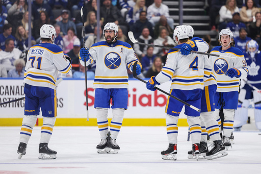 Buffalo Sabres teammates celebrate a goal against the Toronto Maple Leafs during the second period of an NHL hockey game in Toronto, Saturday, Oct. 25, 2025. (Nick Iwanyshyn/The Canadian Press via AP) Buffalo Sabres teammates celebrate a goal against the Toronto Maple Leafs during the second period of an NHL hockey game in Toronto, Saturday, Oct. 25, 2025. (Nick Iwanyshyn/The Canadian Press via AP)